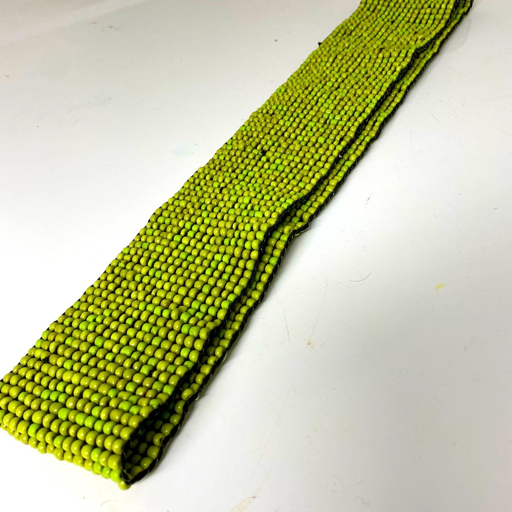 Multi-tonal beaded stretch belt.